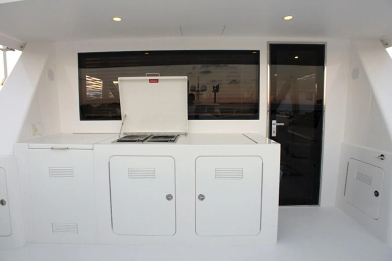 a white machine with a screen aboard SANTO ANTONIO Yacht for Sale