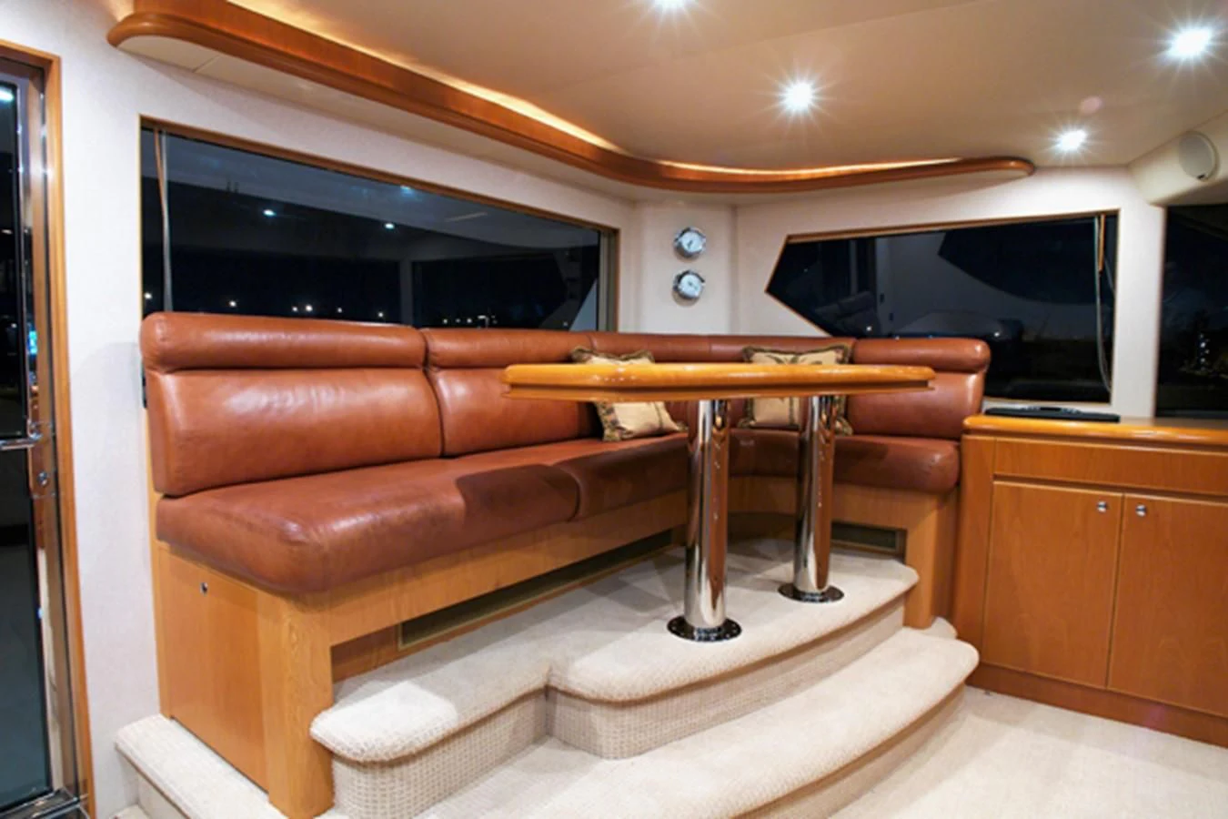 a living room with a couch and a table aboard SANTO ANTONIO Yacht for Sale