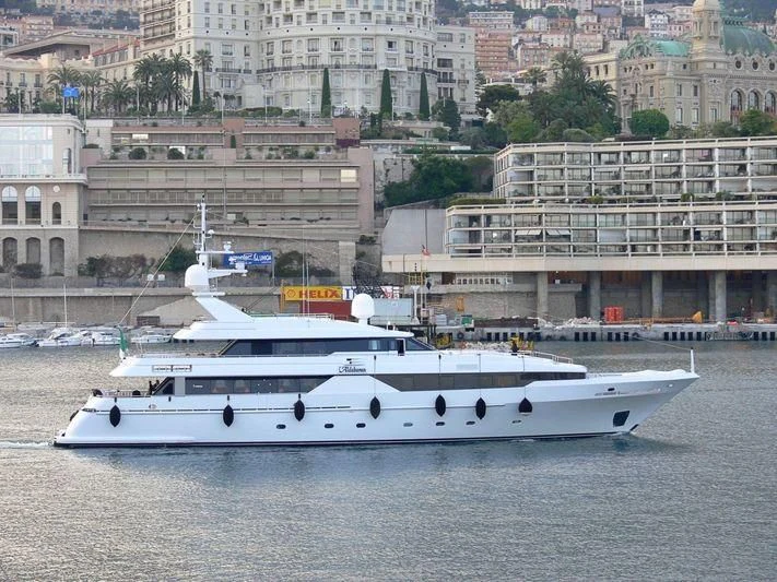 a white boat in a harbor aboard ALDEBARAN PRIMO Yacht for Sale