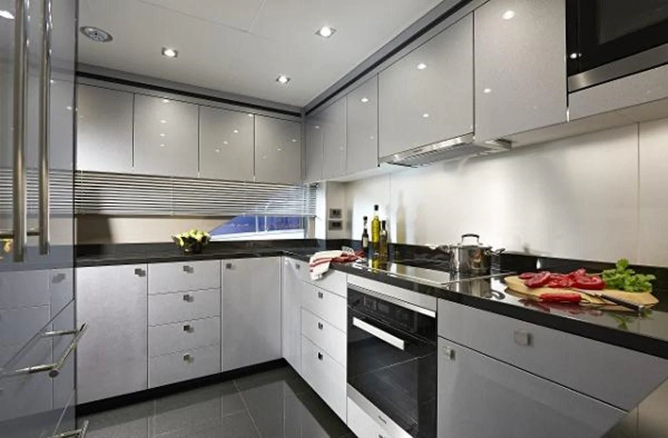a kitchen with white cabinets aboard 95 YACHT Yacht for Sale