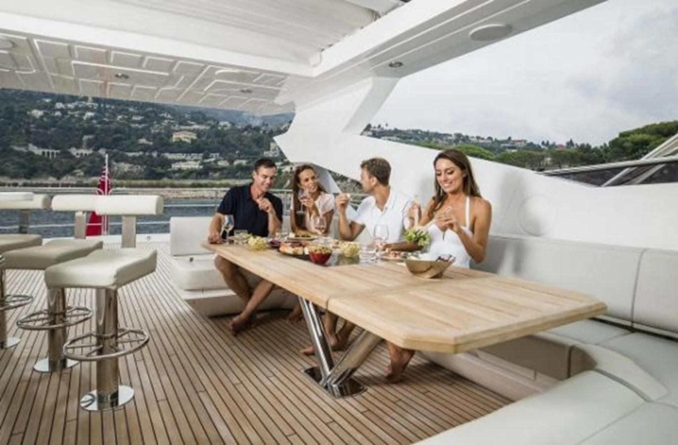 a group of people sitting around a table eating aboard 95 YACHT Yacht for Sale