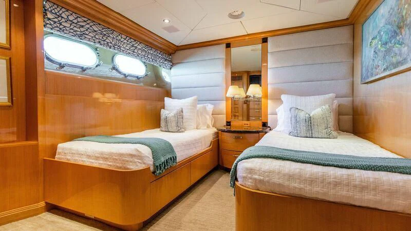 a couple of beds in a room aboard SEAQUEST Yacht for Sale
