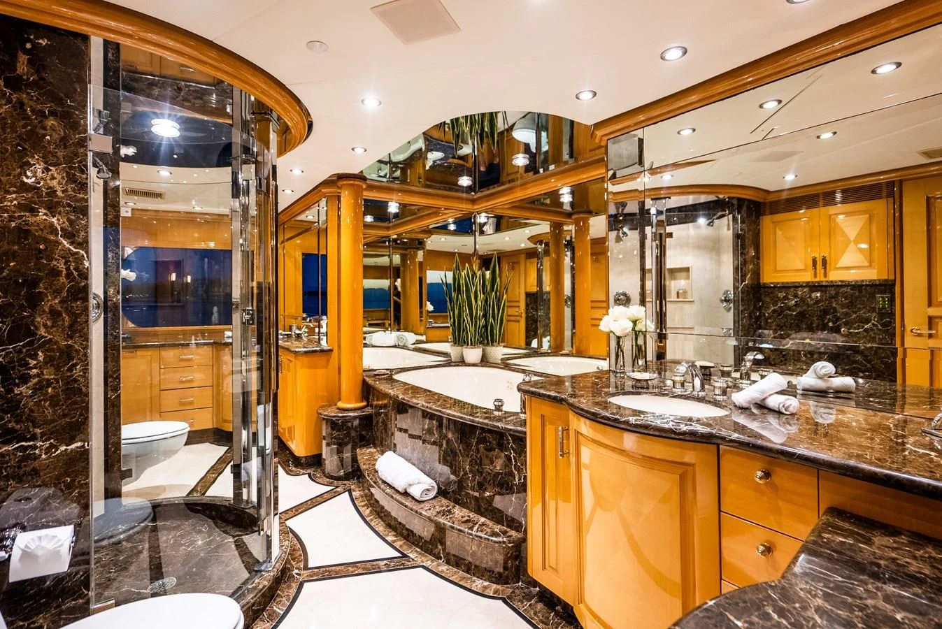 a bathroom with a large glass shower aboard SEAQUEST Yacht for Sale