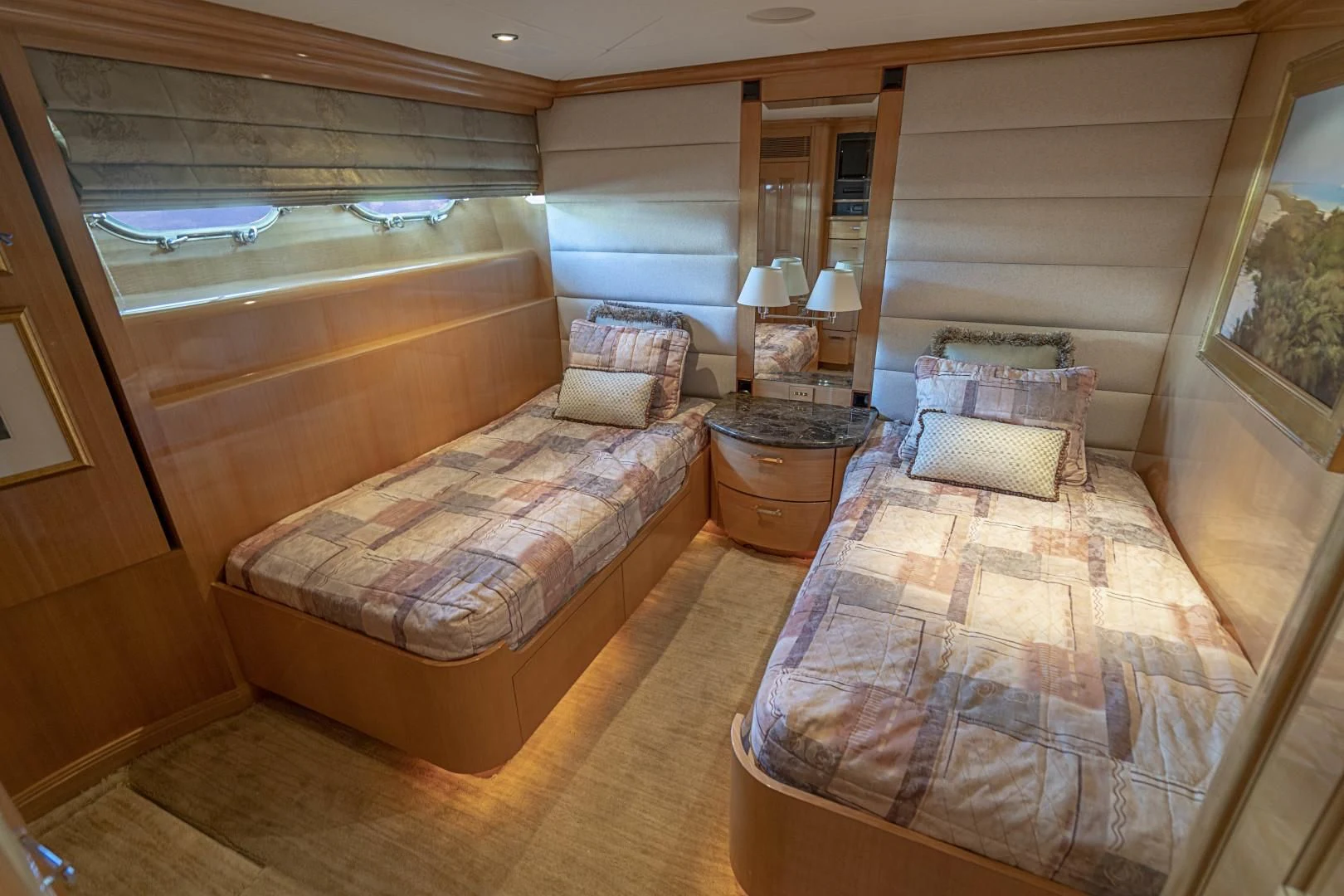a room with a bed and a couch aboard SEAQUEST Yacht for Sale