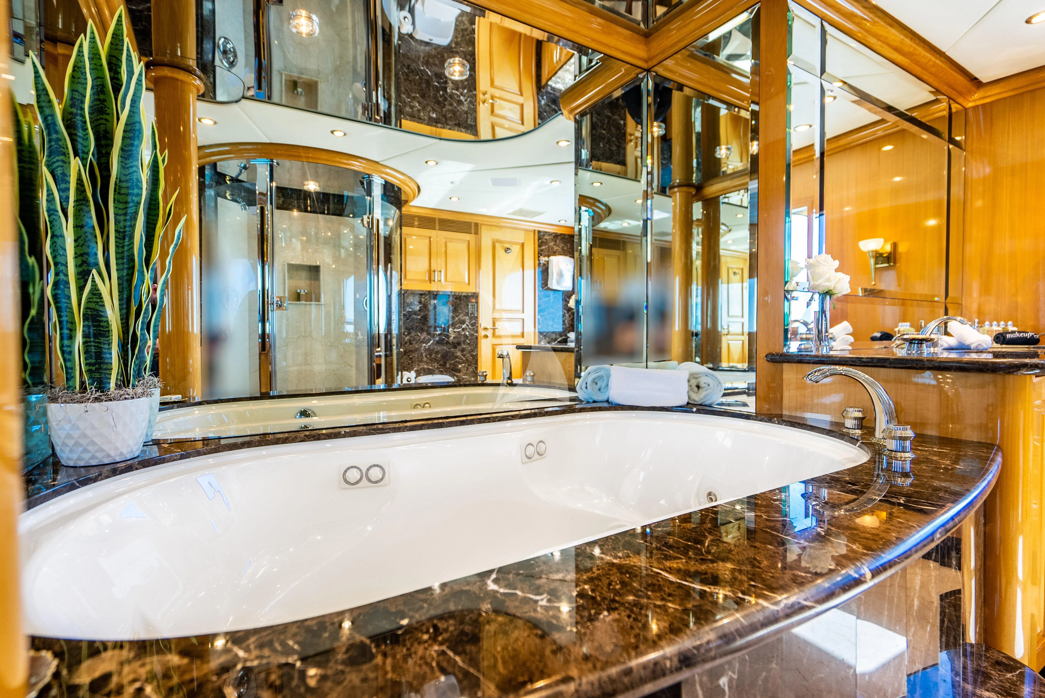 a large bathroom with a large jacuzzi aboard SEAQUEST Yacht for Sale