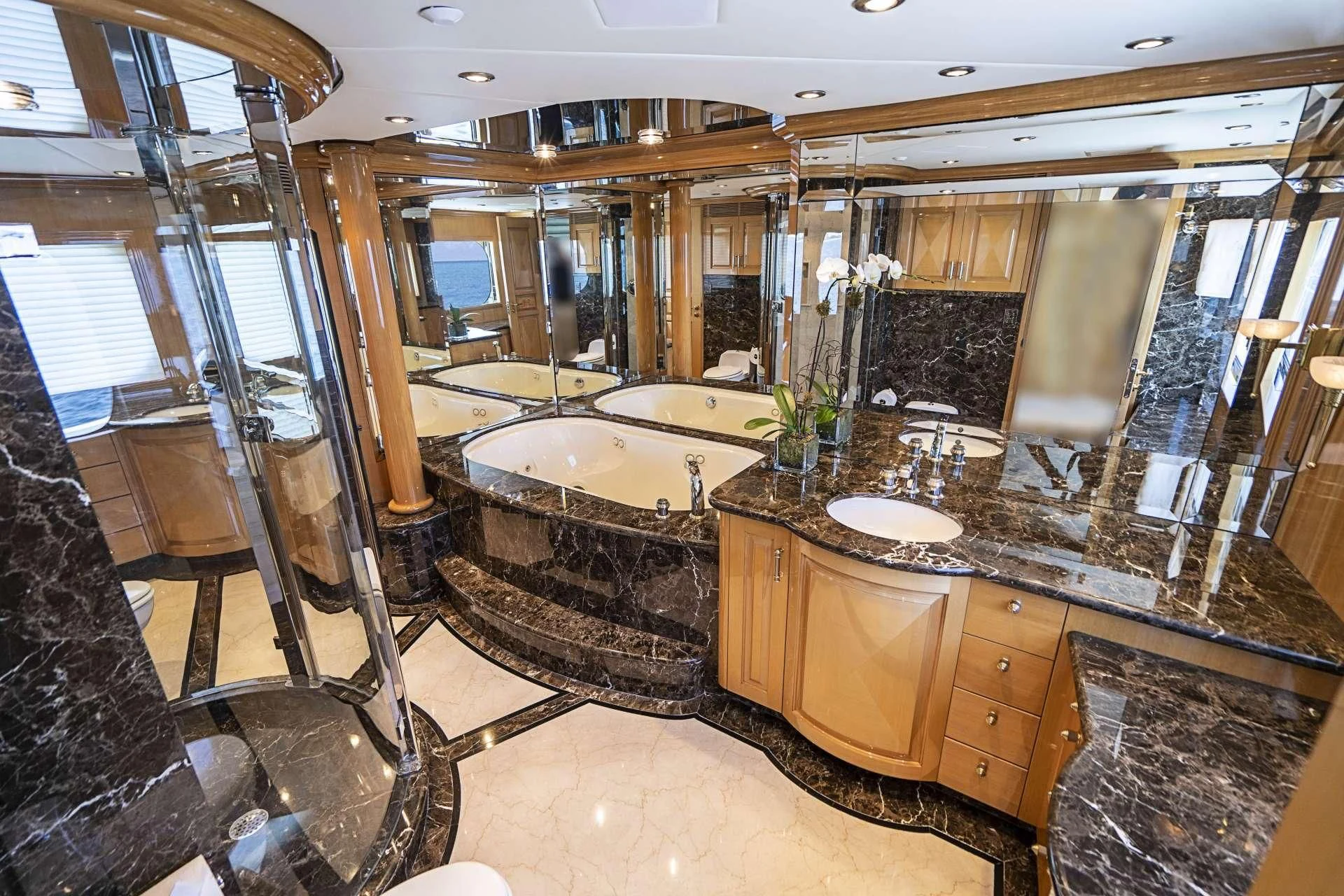 a bathroom with a large marble countertop aboard SEAQUEST Yacht for Sale