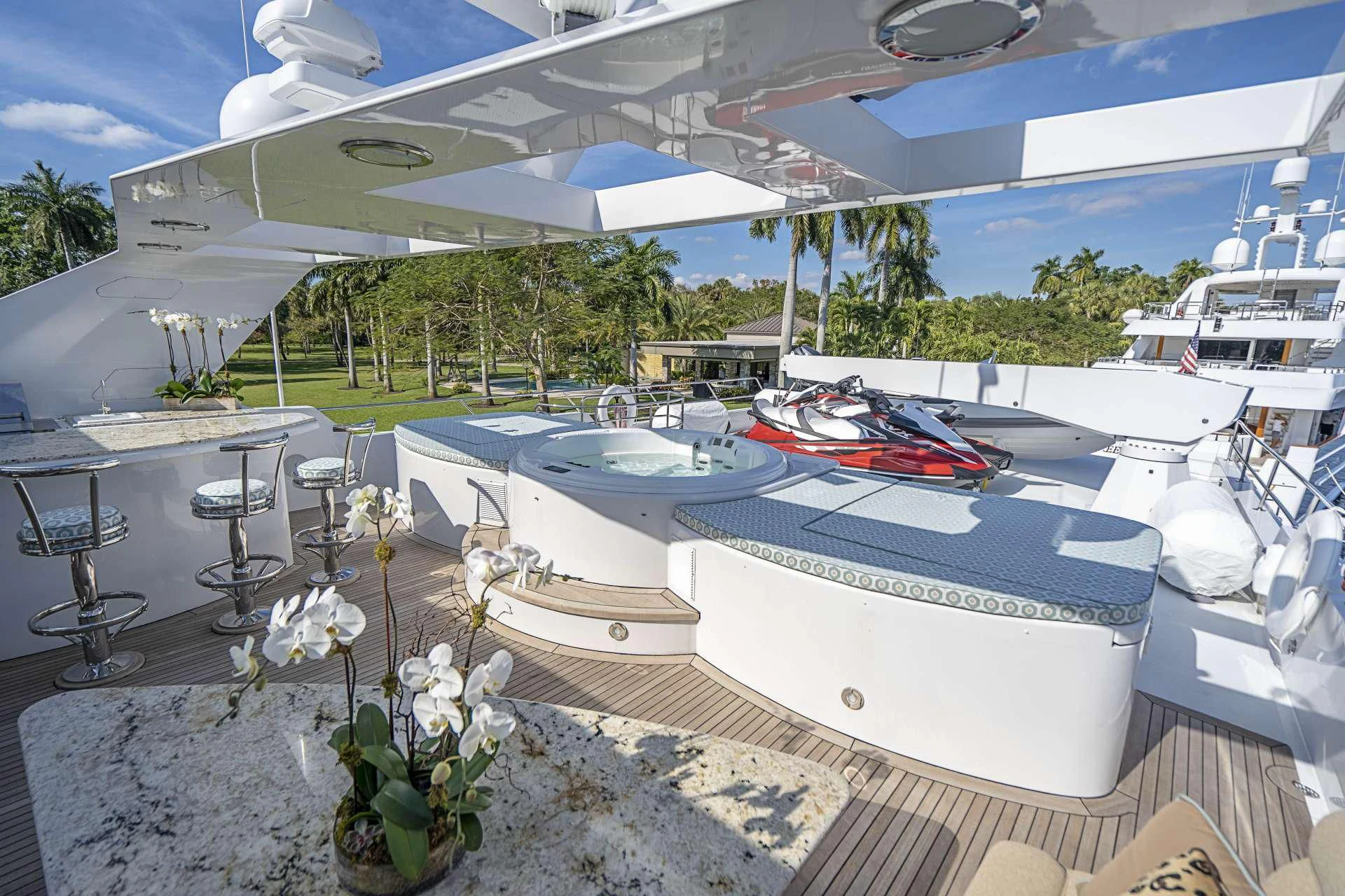 a pool with boats and flowers aboard SEAQUEST Yacht for Sale