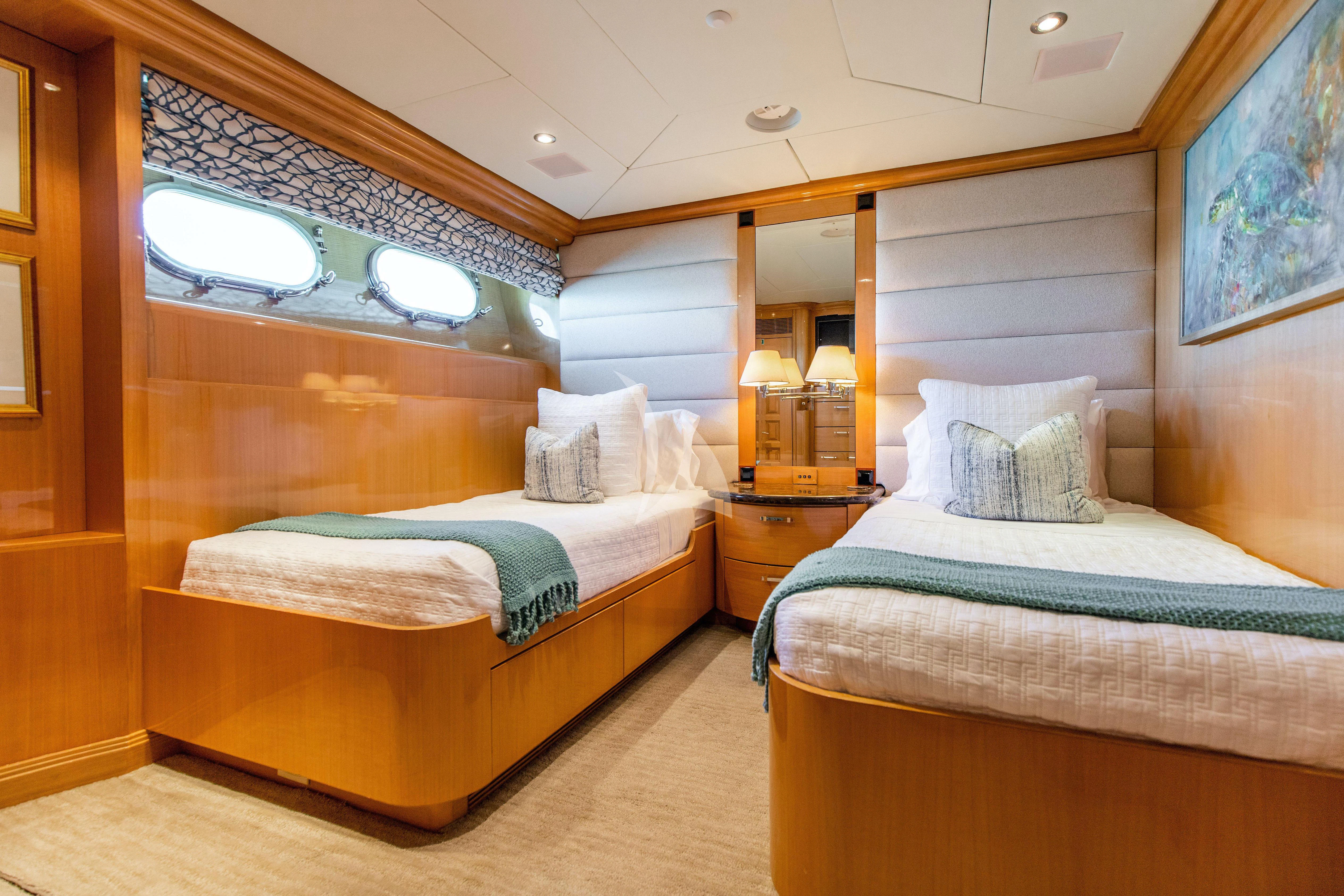 a couple of beds in a room aboard SEAQUEST Yacht for Sale