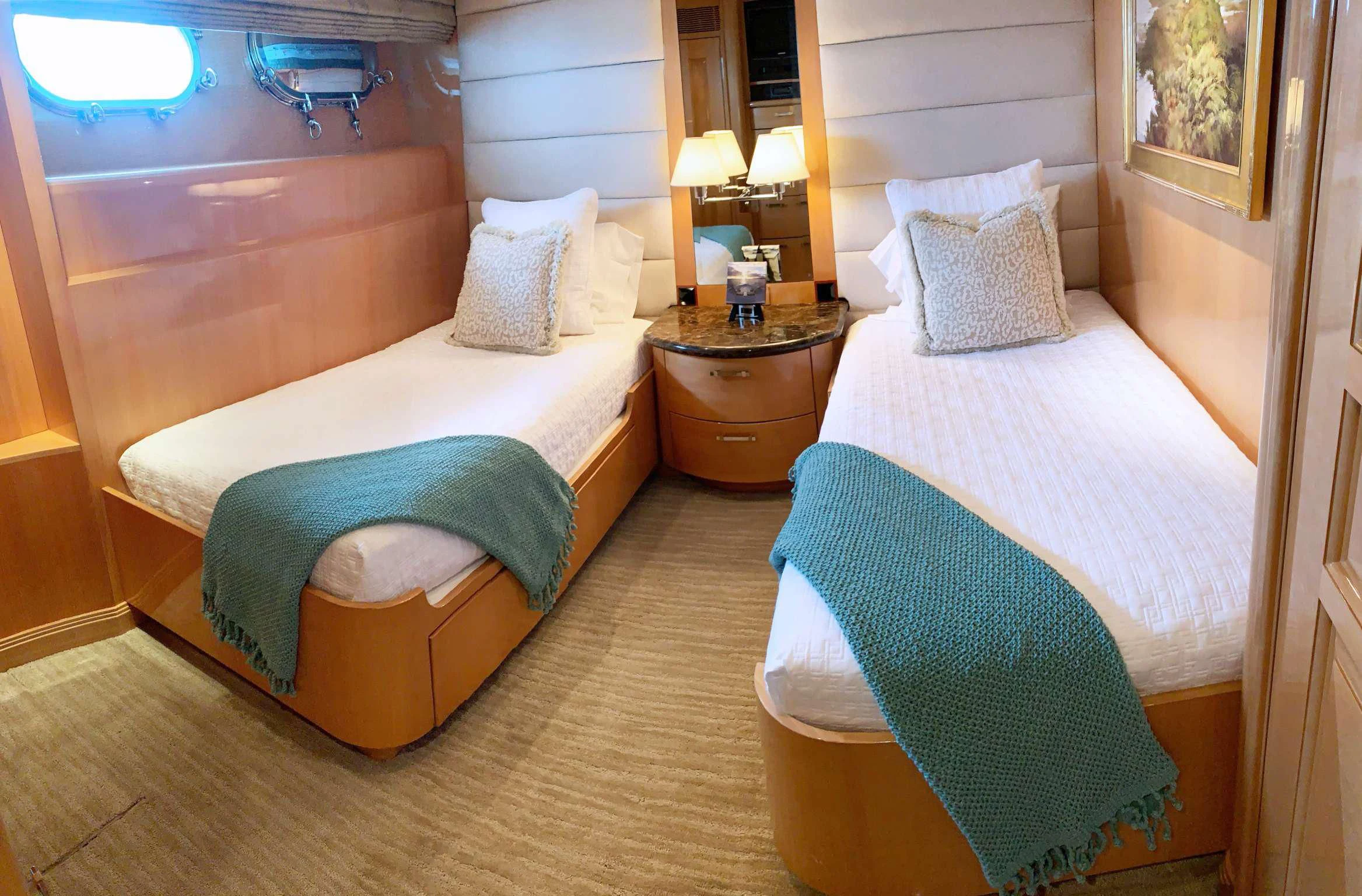 a couple of beds in a hotel room aboard SEAQUEST Yacht for Sale