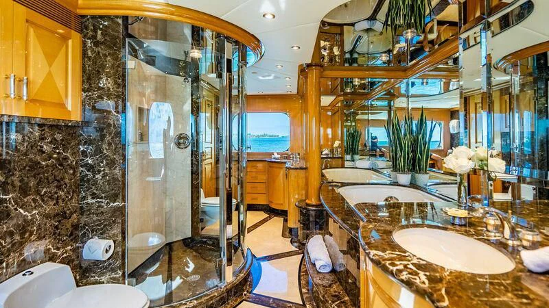 a bathroom with a large glass shower aboard SEAQUEST Yacht for Sale