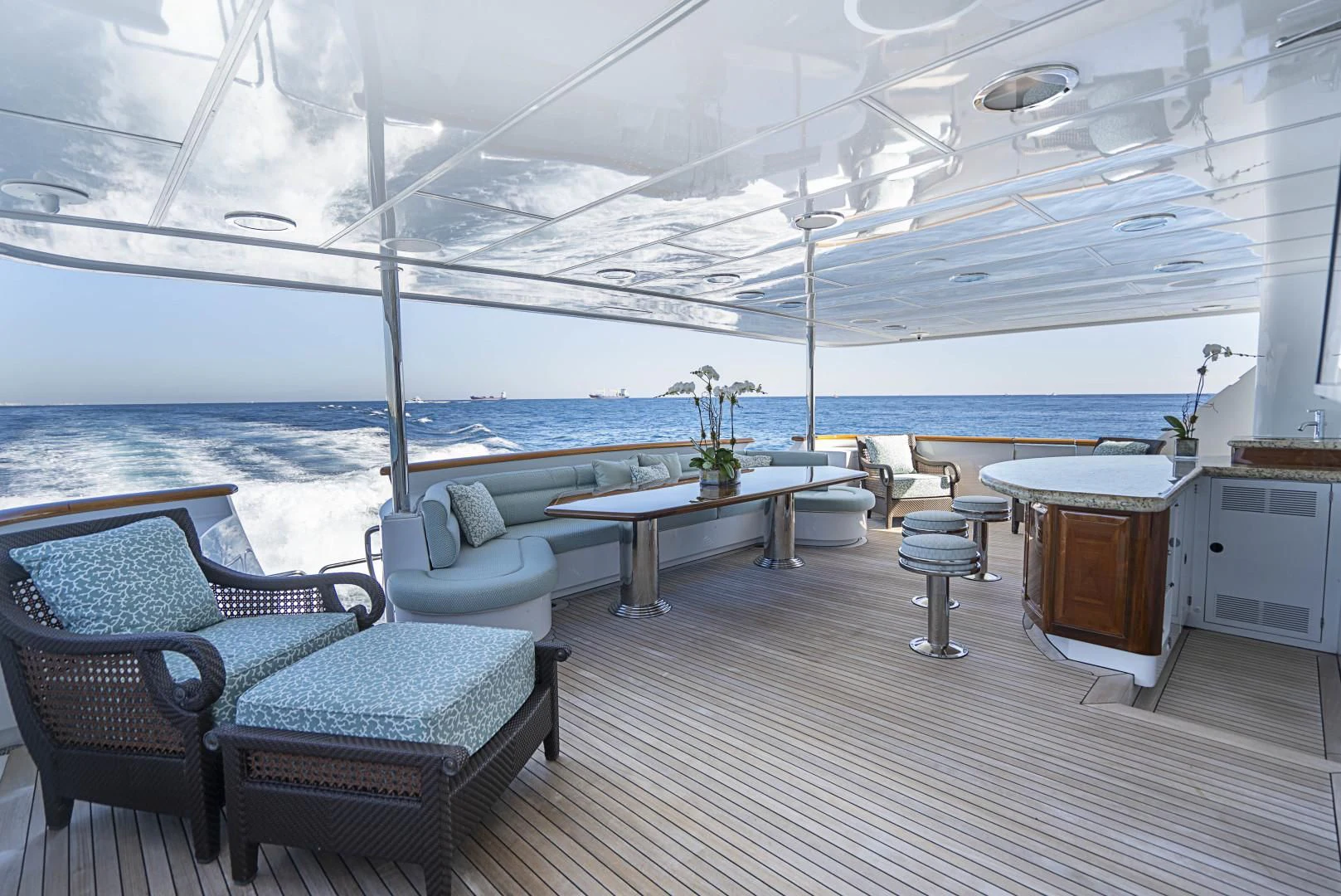 a room with a table chairs and a view of the ocean aboard SEAQUEST Yacht for Sale
