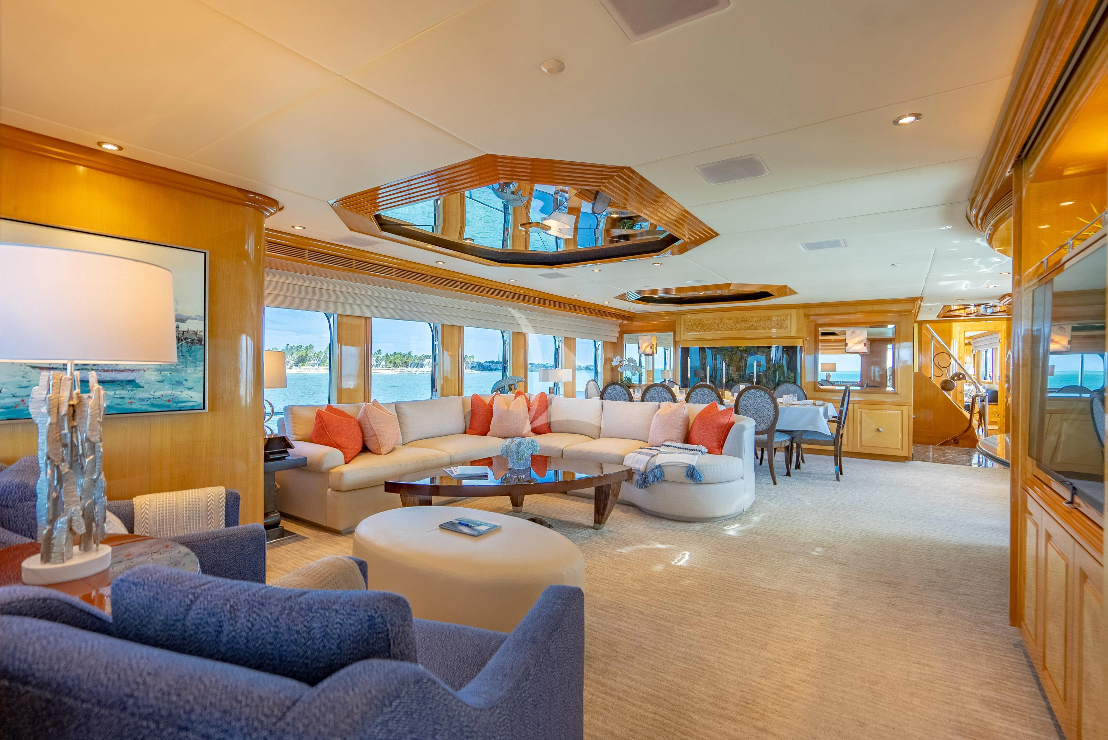 a living room with a large mirror aboard SEAQUEST Yacht for Sale