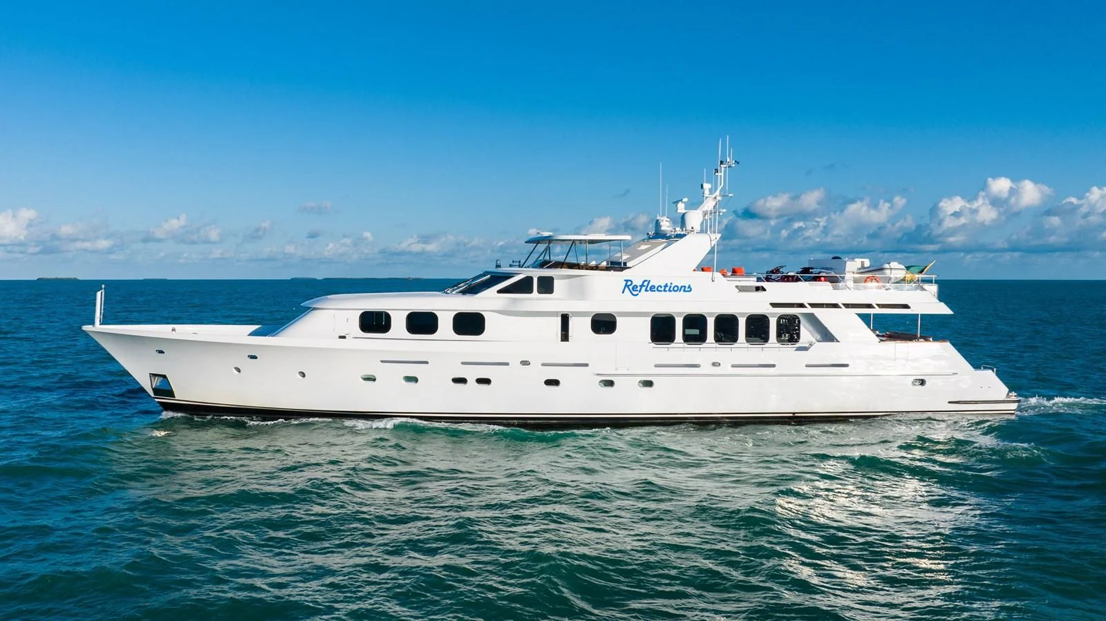 a white yacht in the water aboard SEAQUEST Yacht for Sale