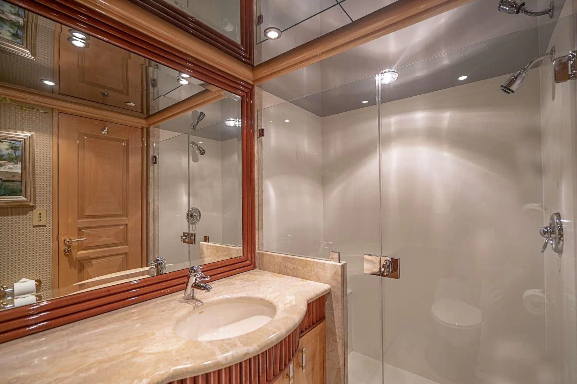 a bathroom with a large mirror aboard SEAQUEST Yacht for Sale