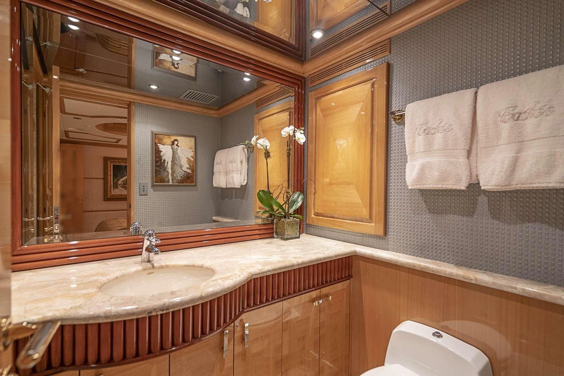 a bathroom with a large mirror aboard SEAQUEST Yacht for Sale