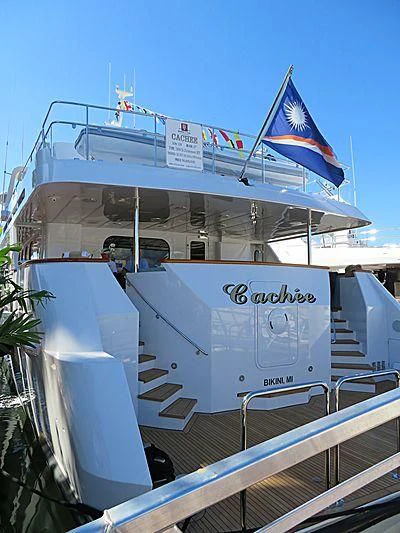 a large white boat with flags on it aboard SEAQUEST Yacht for Sale