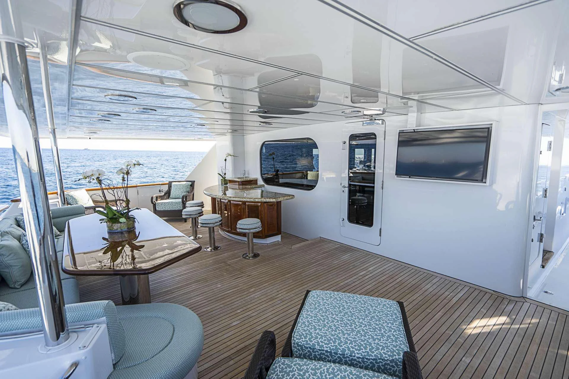 a room with a table and chairs aboard SEAQUEST Yacht for Sale