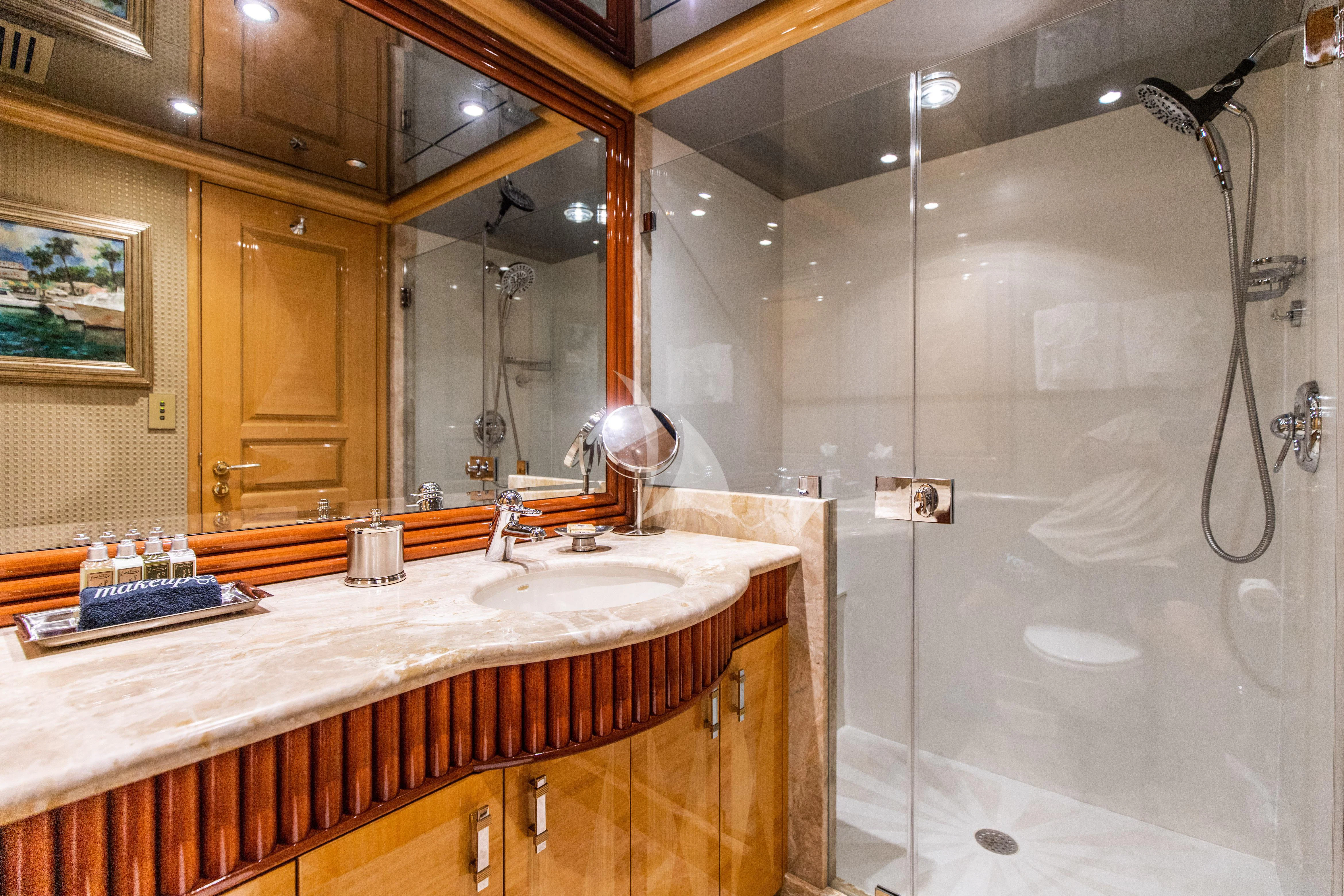 a bathroom with a shower and sink aboard SEAQUEST Yacht for Sale