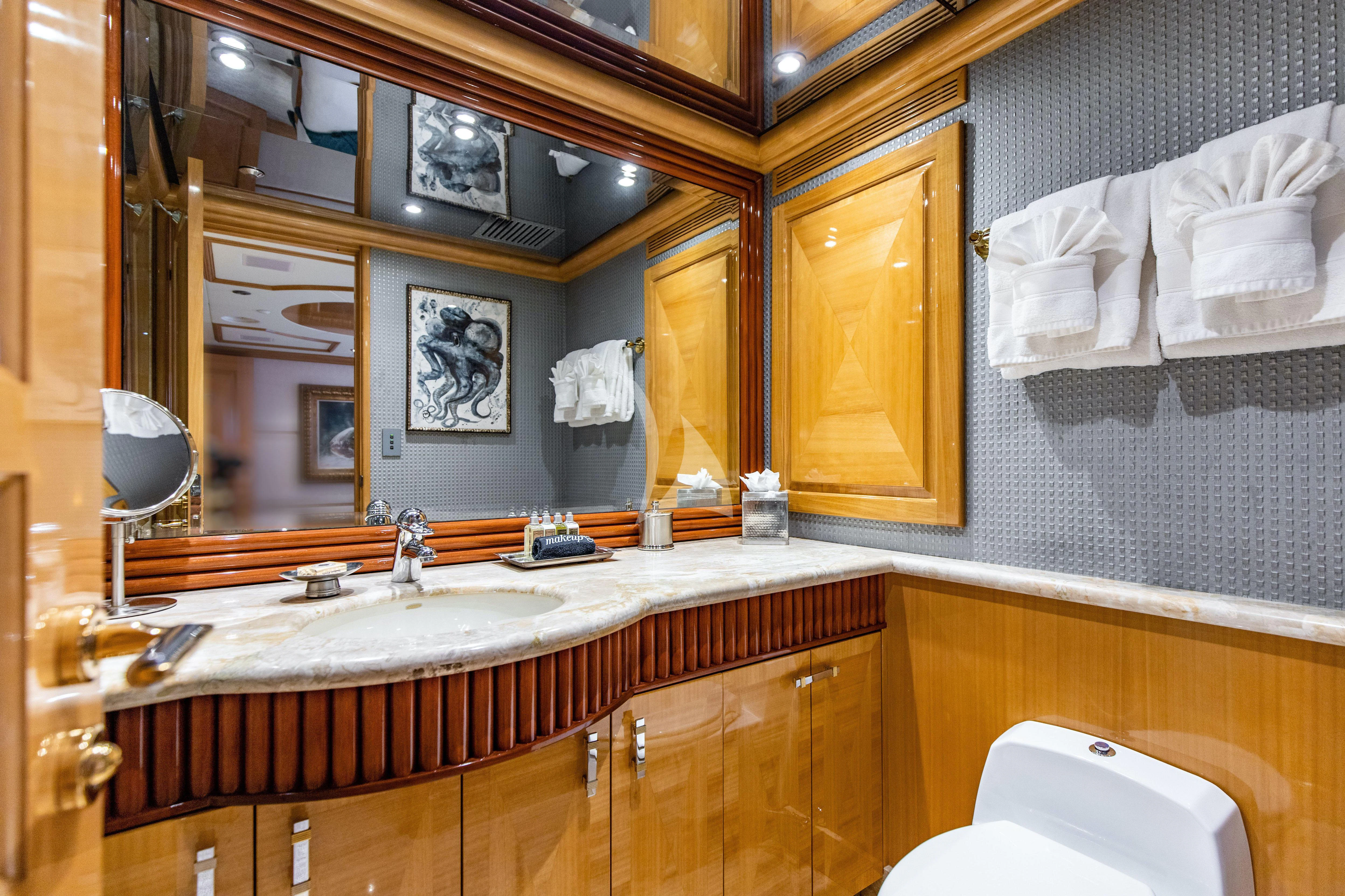 a bathroom with a large mirror aboard SEAQUEST Yacht for Sale