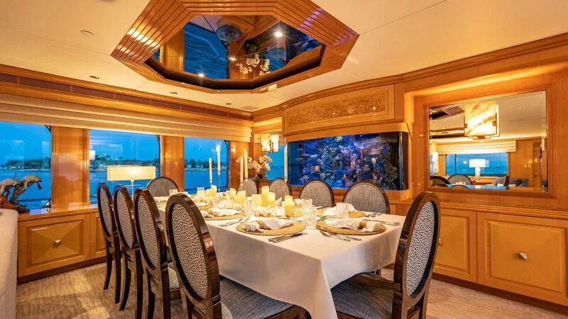 a dining room with a table and chairs aboard SEAQUEST Yacht for Sale