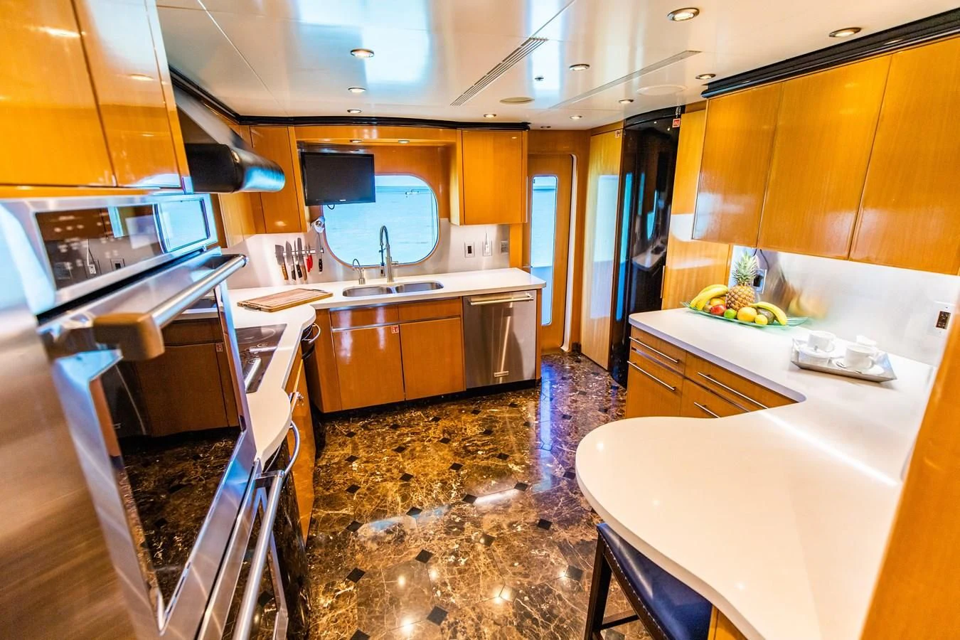 a kitchen with a marble floor aboard SEAQUEST Yacht for Sale