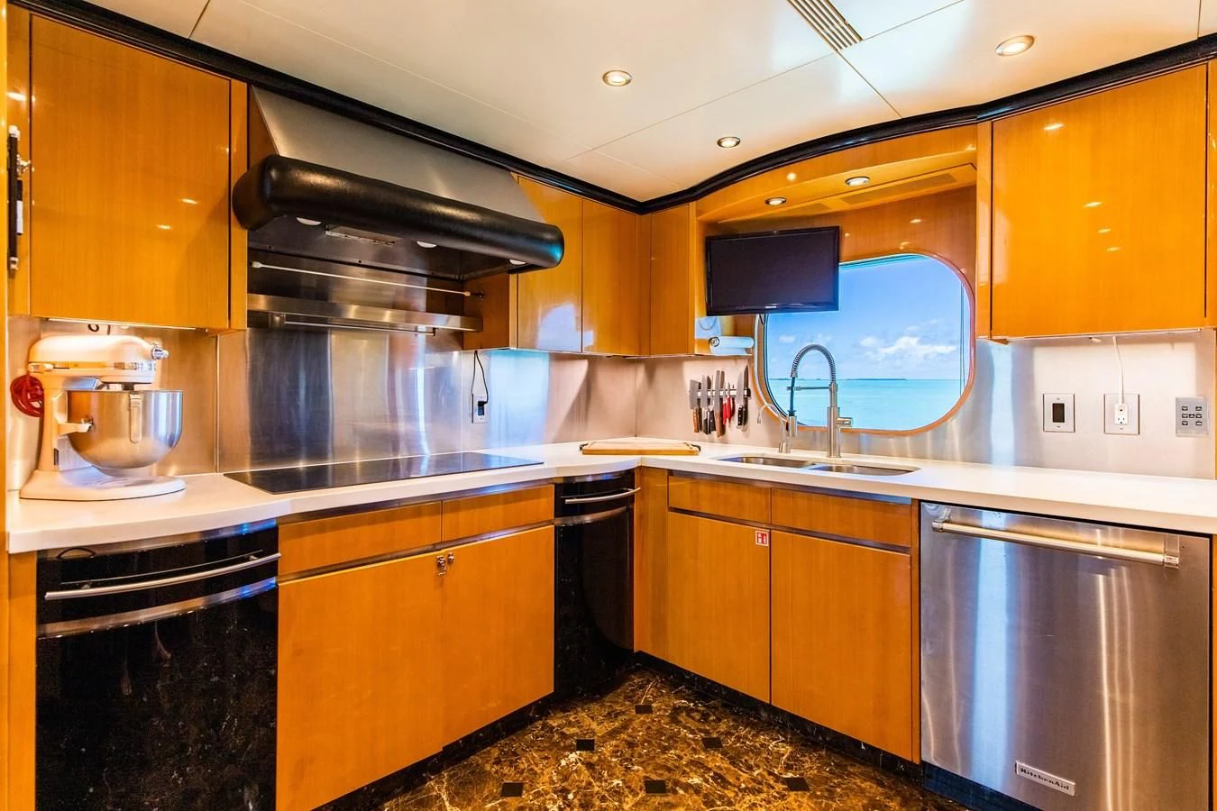 a kitchen with wooden cabinets aboard SEAQUEST Yacht for Sale
