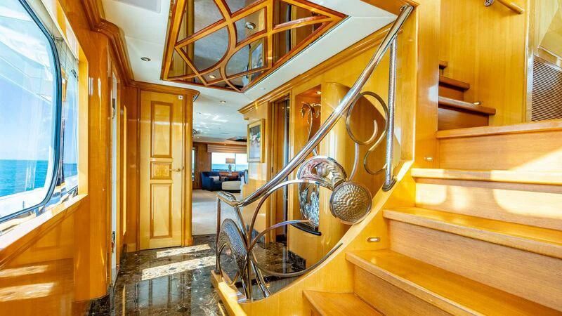 a staircase with wood railings aboard SEAQUEST Yacht for Sale