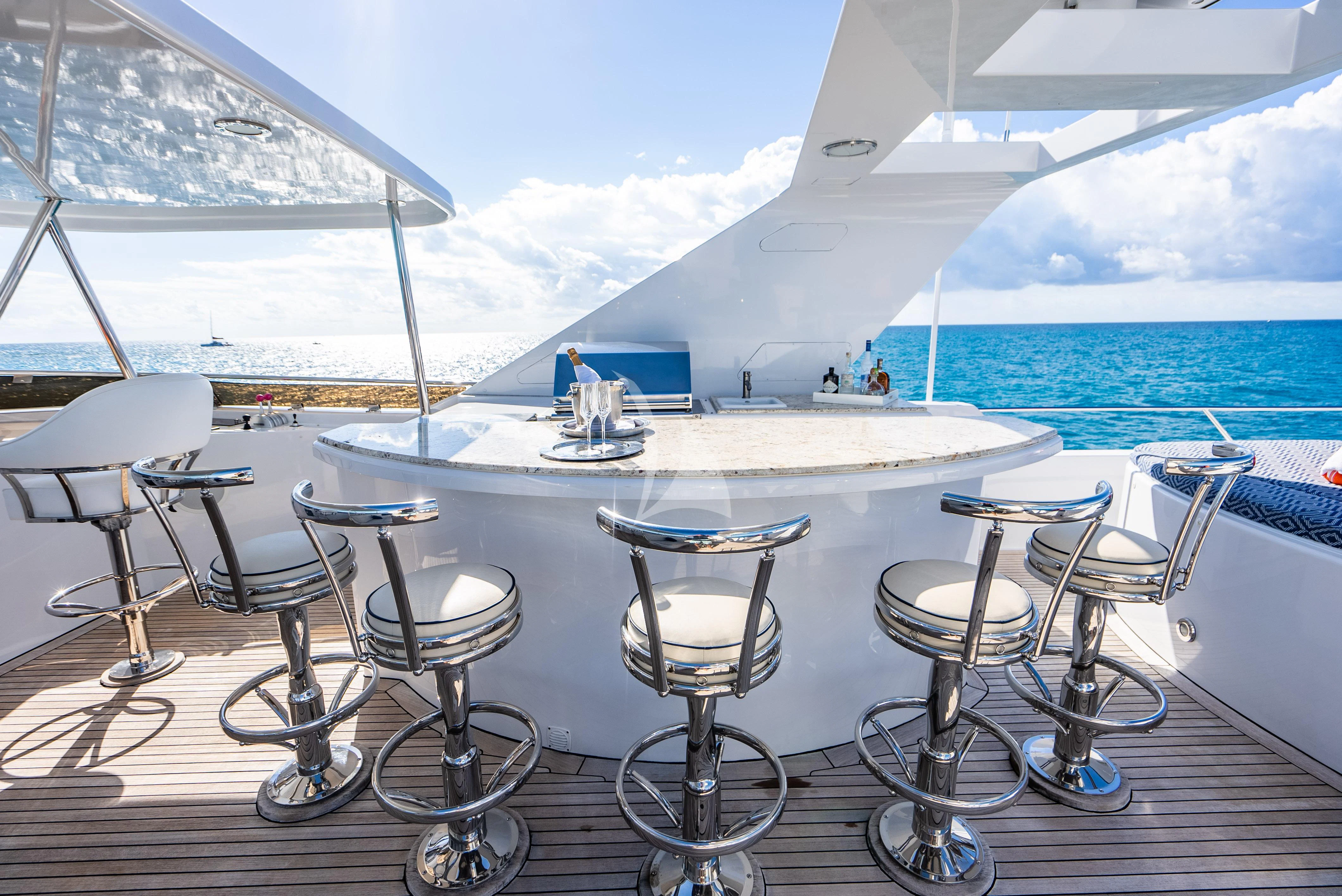 a table set up on a beach aboard SEAQUEST Yacht for Sale