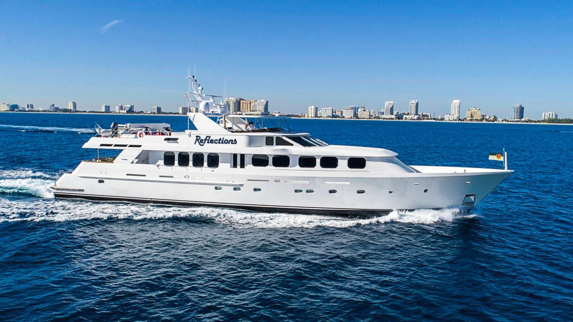 a white yacht on the water aboard SEAQUEST Yacht for Sale