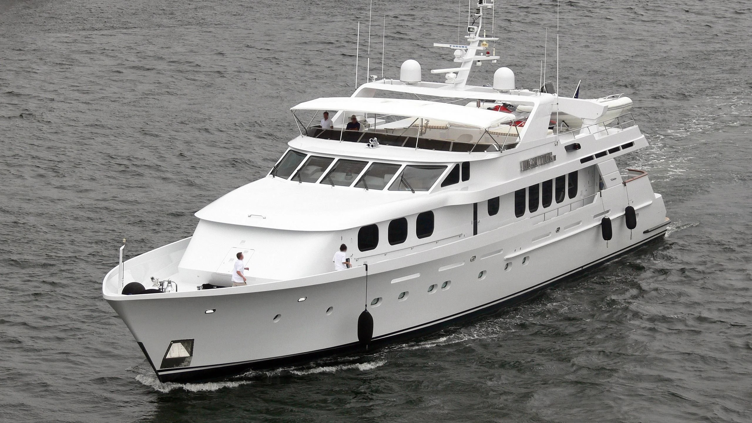 a white boat on the water aboard SEAQUEST Yacht for Sale