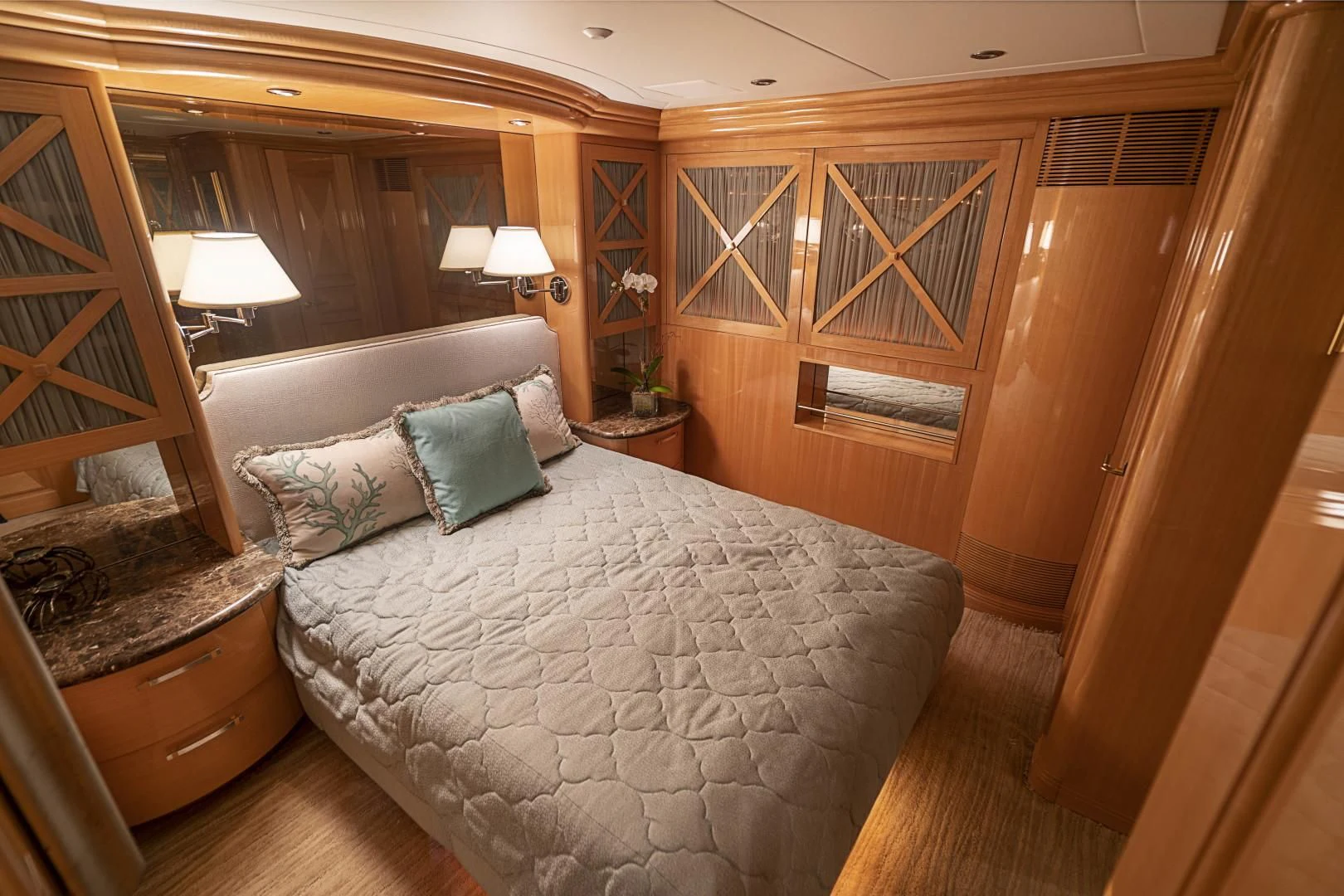 a bedroom with a bed and a couch aboard SEAQUEST Yacht for Sale
