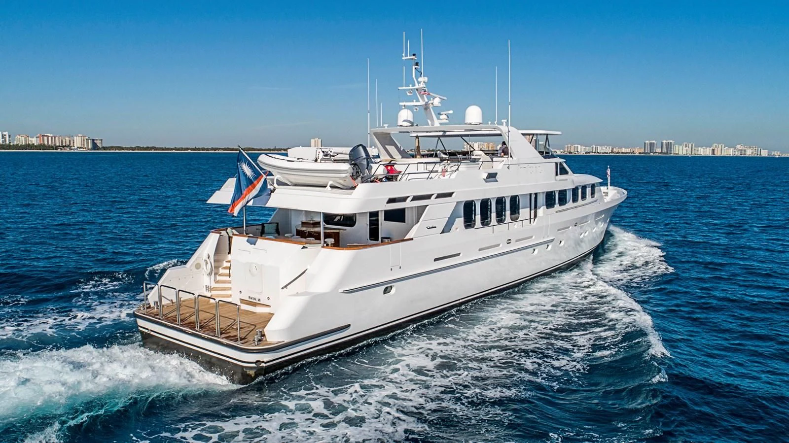 a large white boat on the water aboard SEAQUEST Yacht for Sale