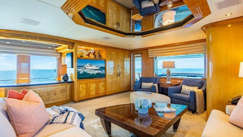 a living room with a large window aboard SEAQUEST Yacht for Sale