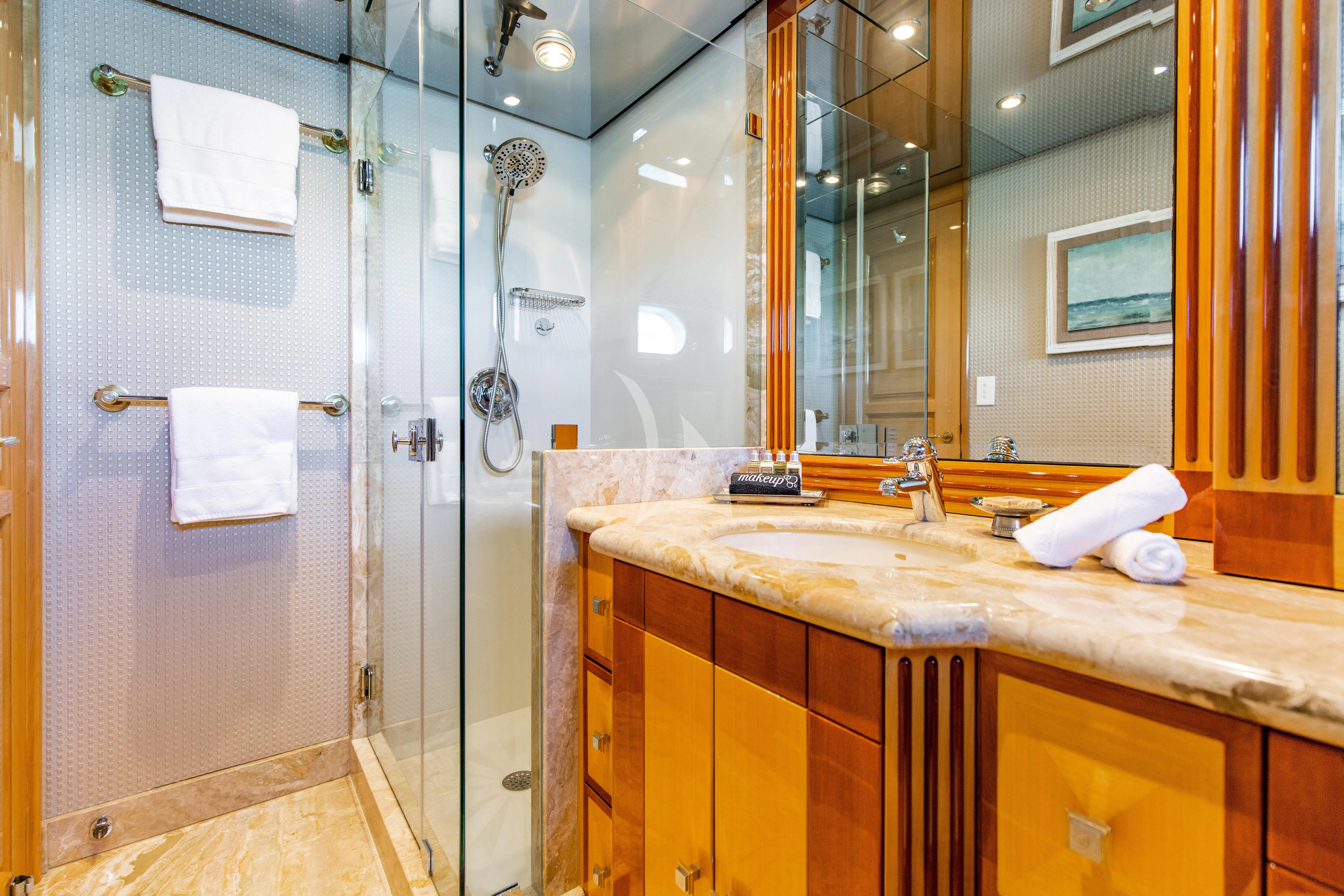 a bathroom with a sink and a mirror aboard SEAQUEST Yacht for Sale
