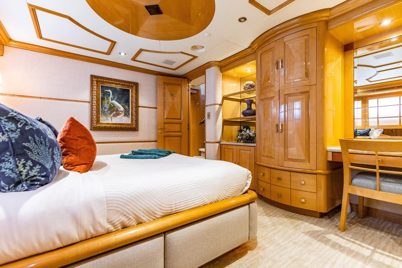a bedroom with a bed and a closet aboard SEAQUEST Yacht for Sale