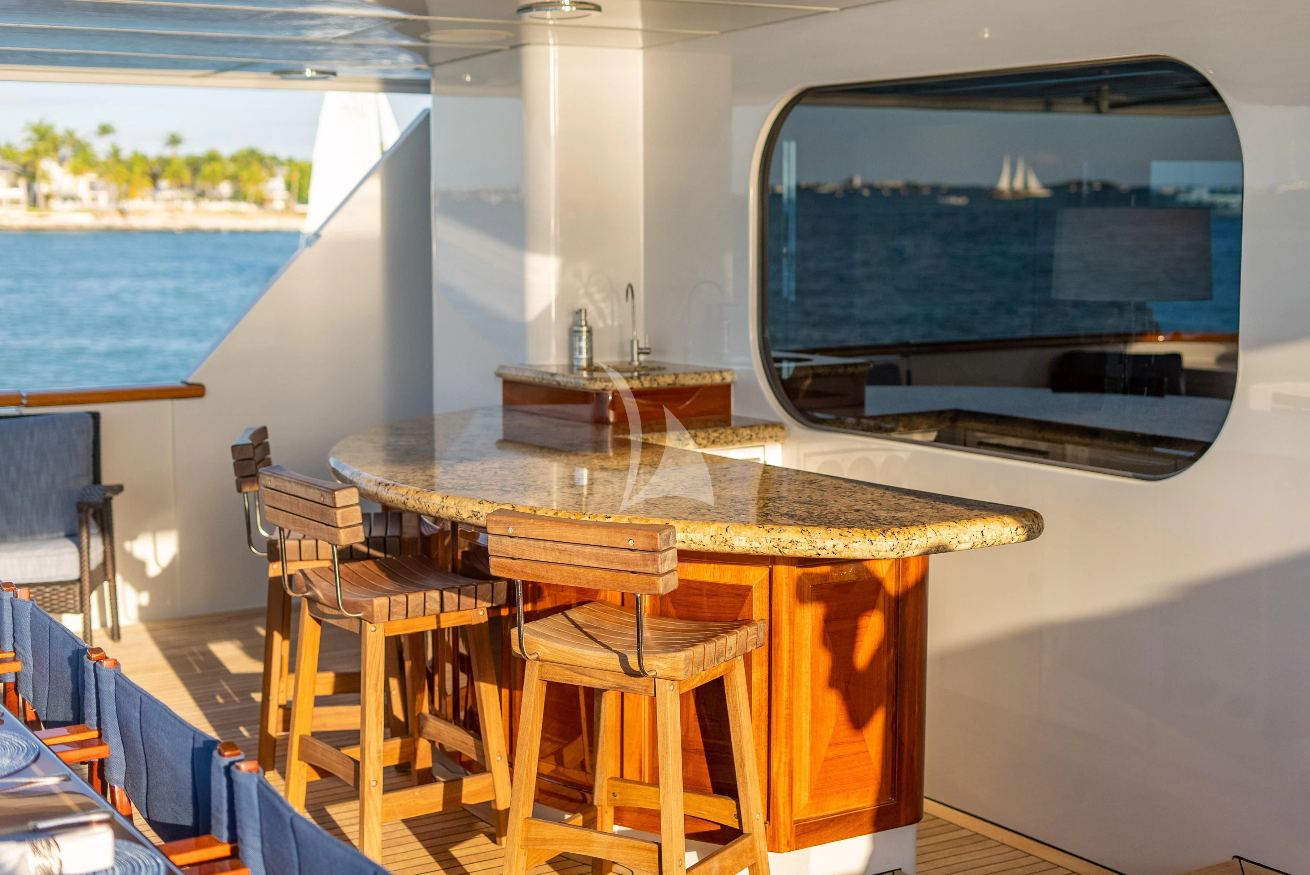 a table and chairs on a deck aboard SEAQUEST Yacht for Sale
