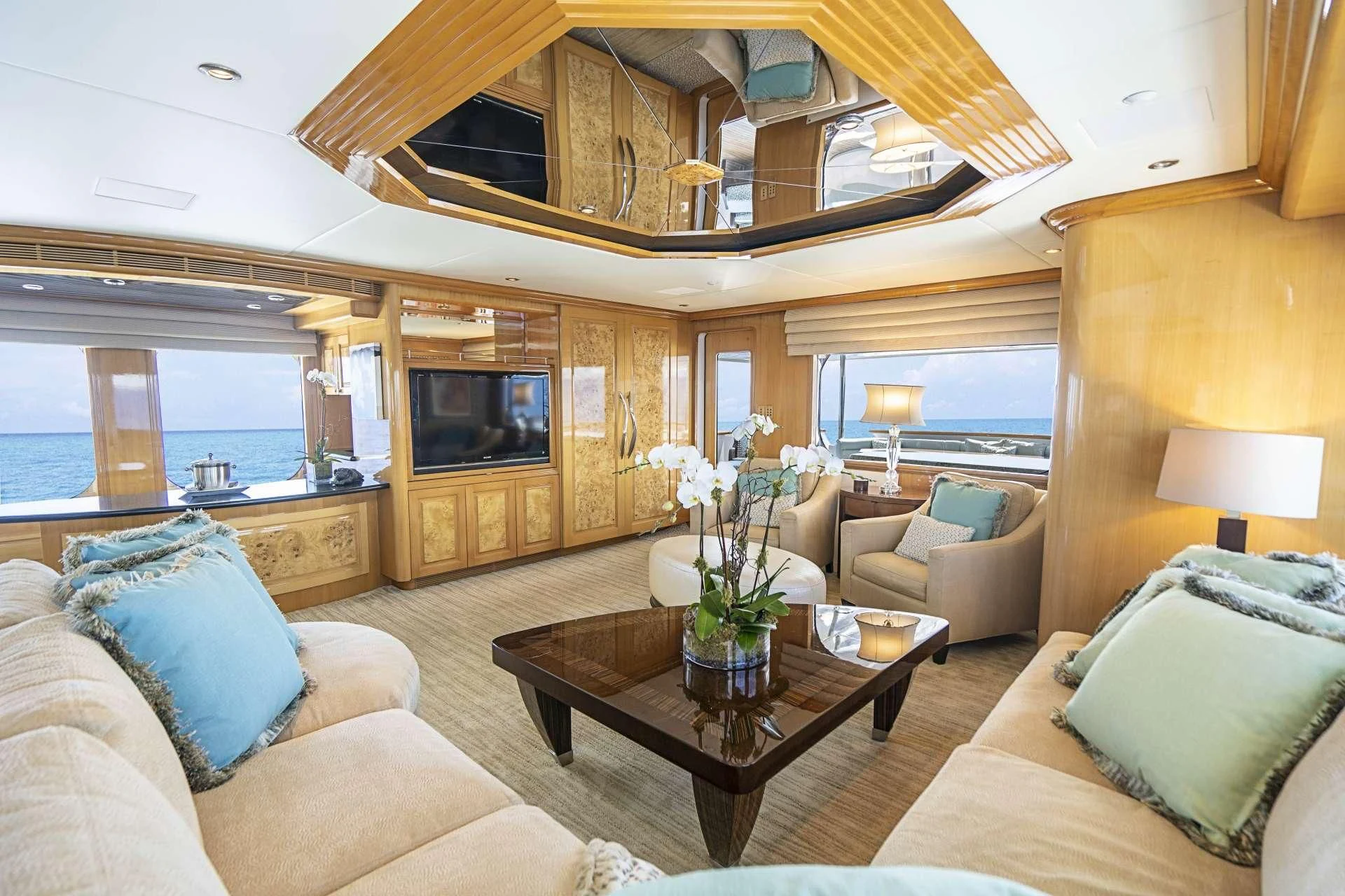 a living room with a couch and a television aboard SEAQUEST Yacht for Sale