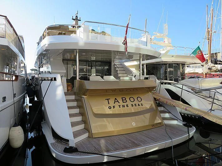a boat docked at a pier aboard KIMOJO Yacht for Sale