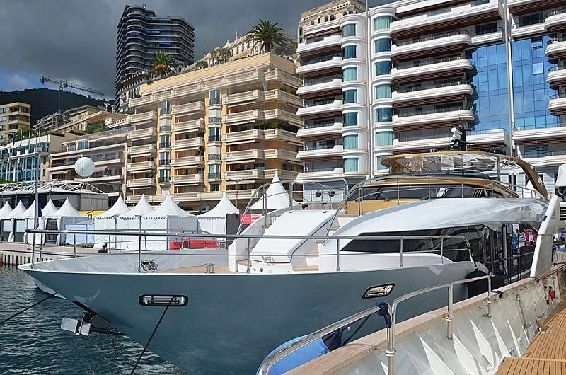 a boat docked in front of a building aboard KIMOJO Yacht for Sale