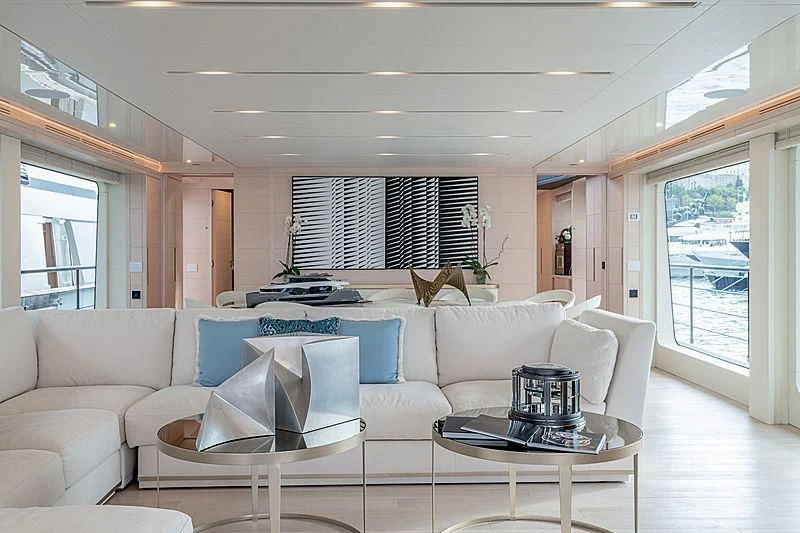 a living room with a couch and a table aboard KIMOJO Yacht for Sale