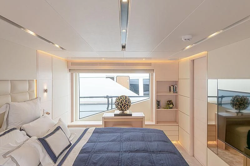 a room with a bed and a window aboard KIMOJO Yacht for Sale