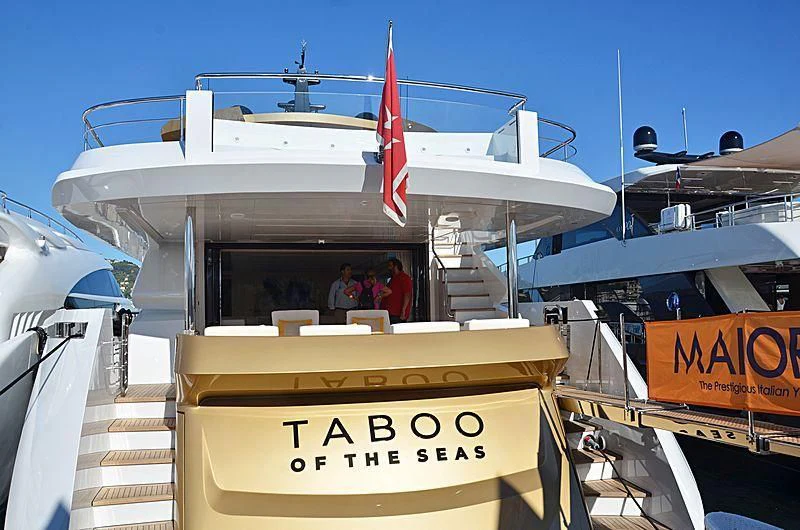 a boat with a sign on the front aboard KIMOJO Yacht for Sale