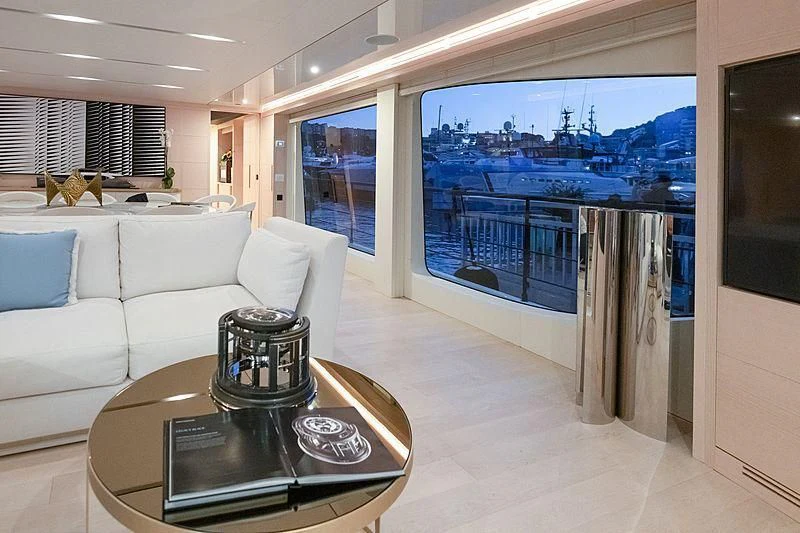 a living room with a large glass window aboard KIMOJO Yacht for Sale
