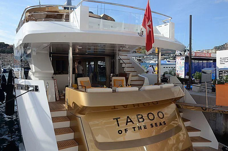 a boat with a sign on the front aboard KIMOJO Yacht for Sale
