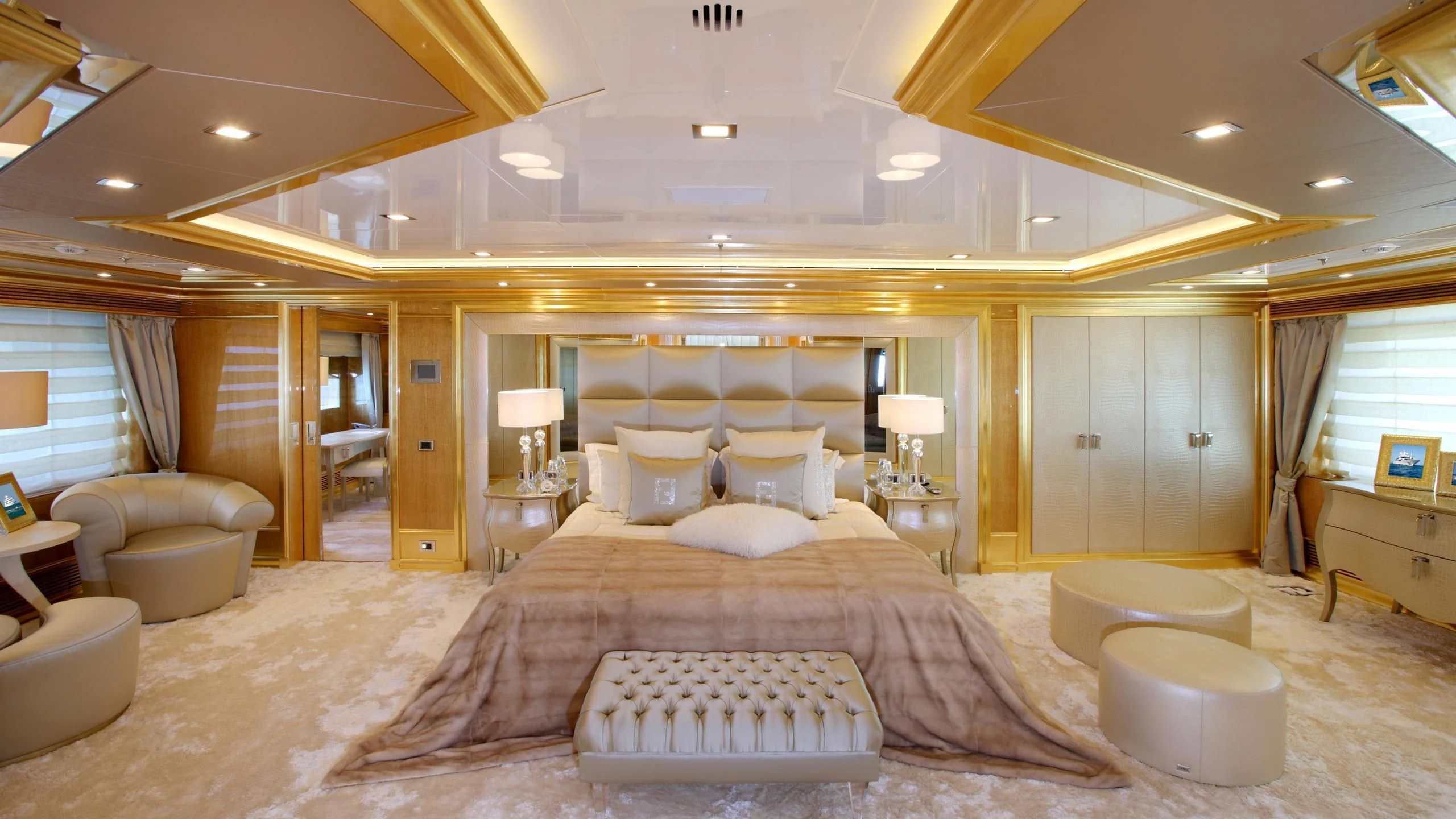 a large bedroom with a large bed aboard MONARCH Yacht for Sale
