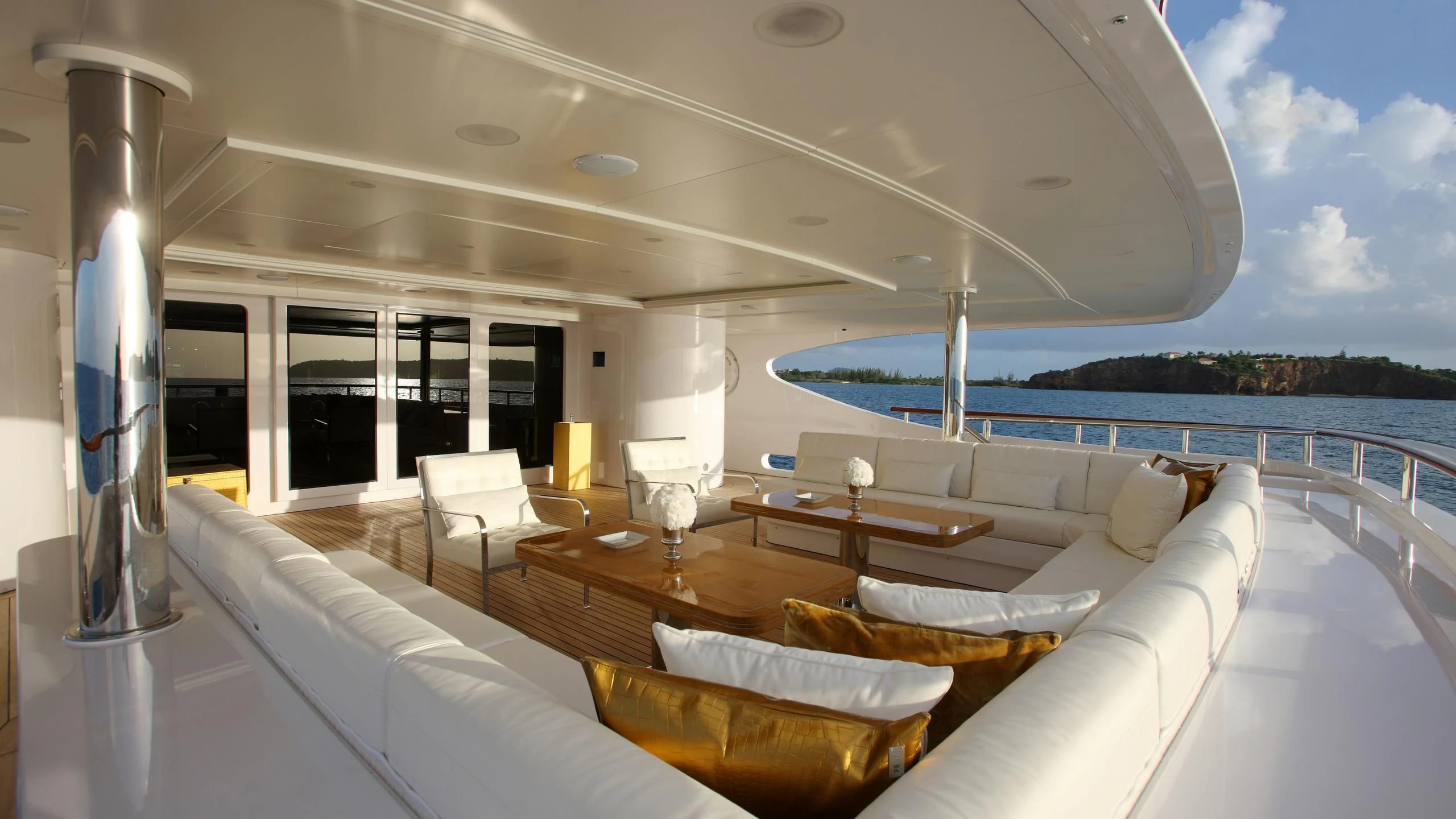 a large living room with a large balcony aboard MONARCH Yacht for Sale