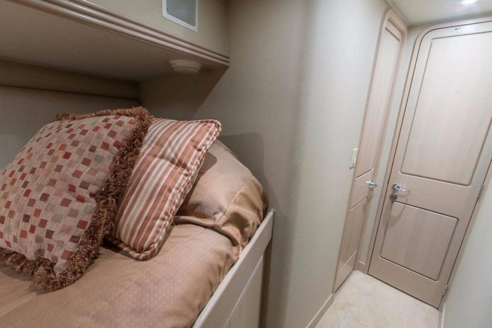 a bed with a pillow aboard MONARCH Yacht for Sale