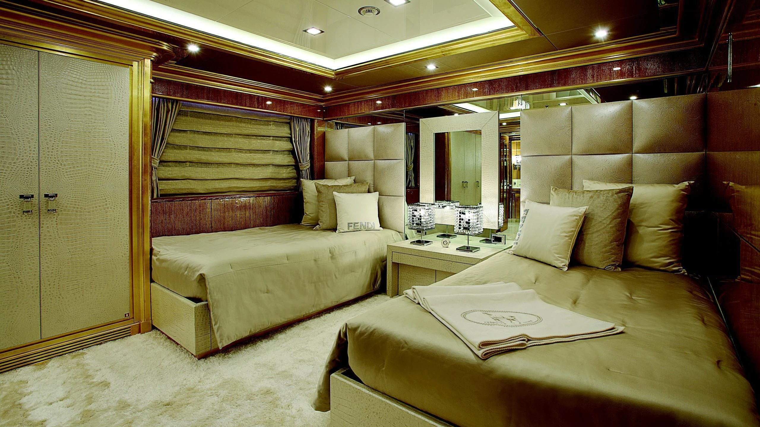 a room with a bed and a mirror aboard MONARCH Yacht for Sale