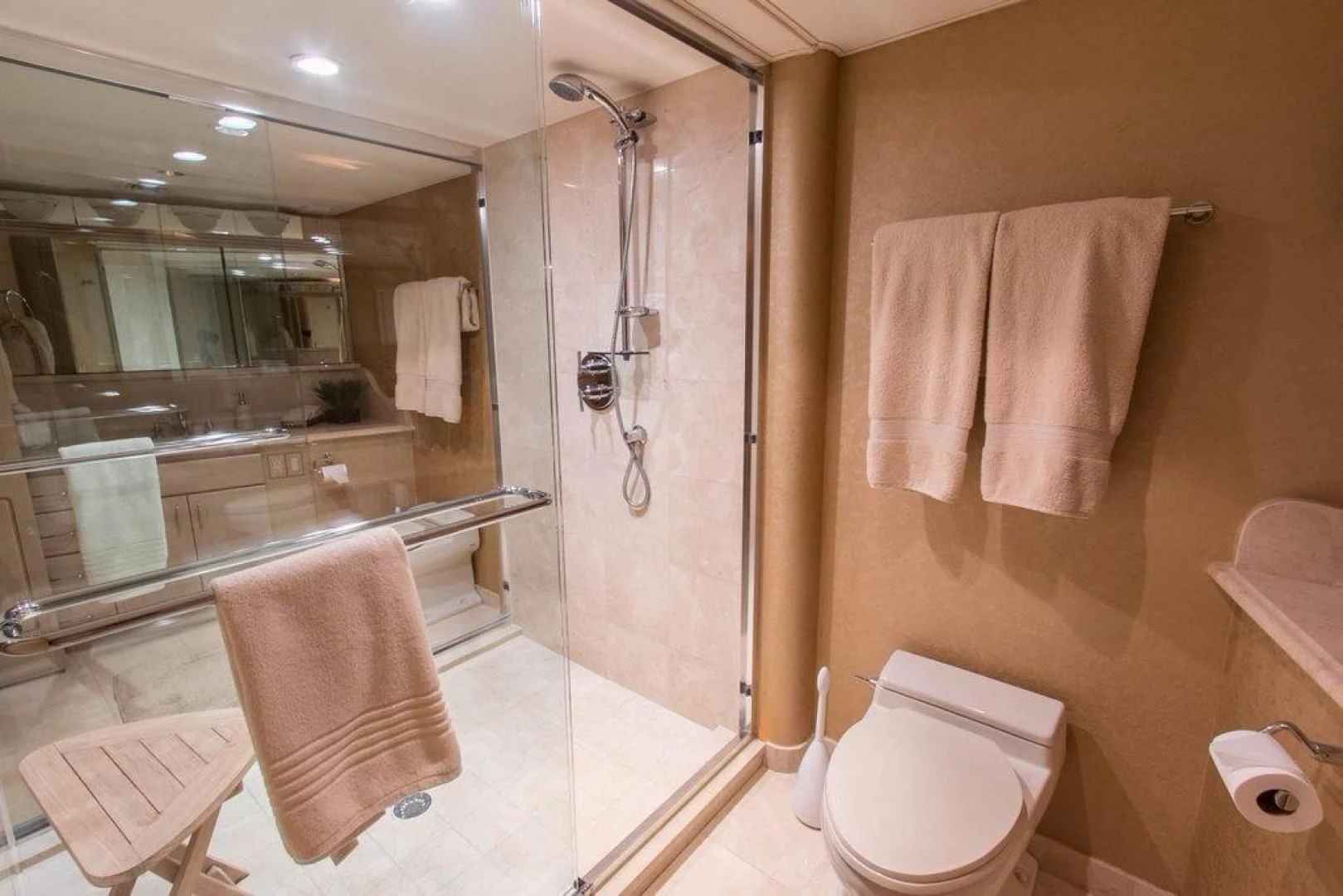a bathroom with a shower and toilet aboard MONARCH Yacht for Sale