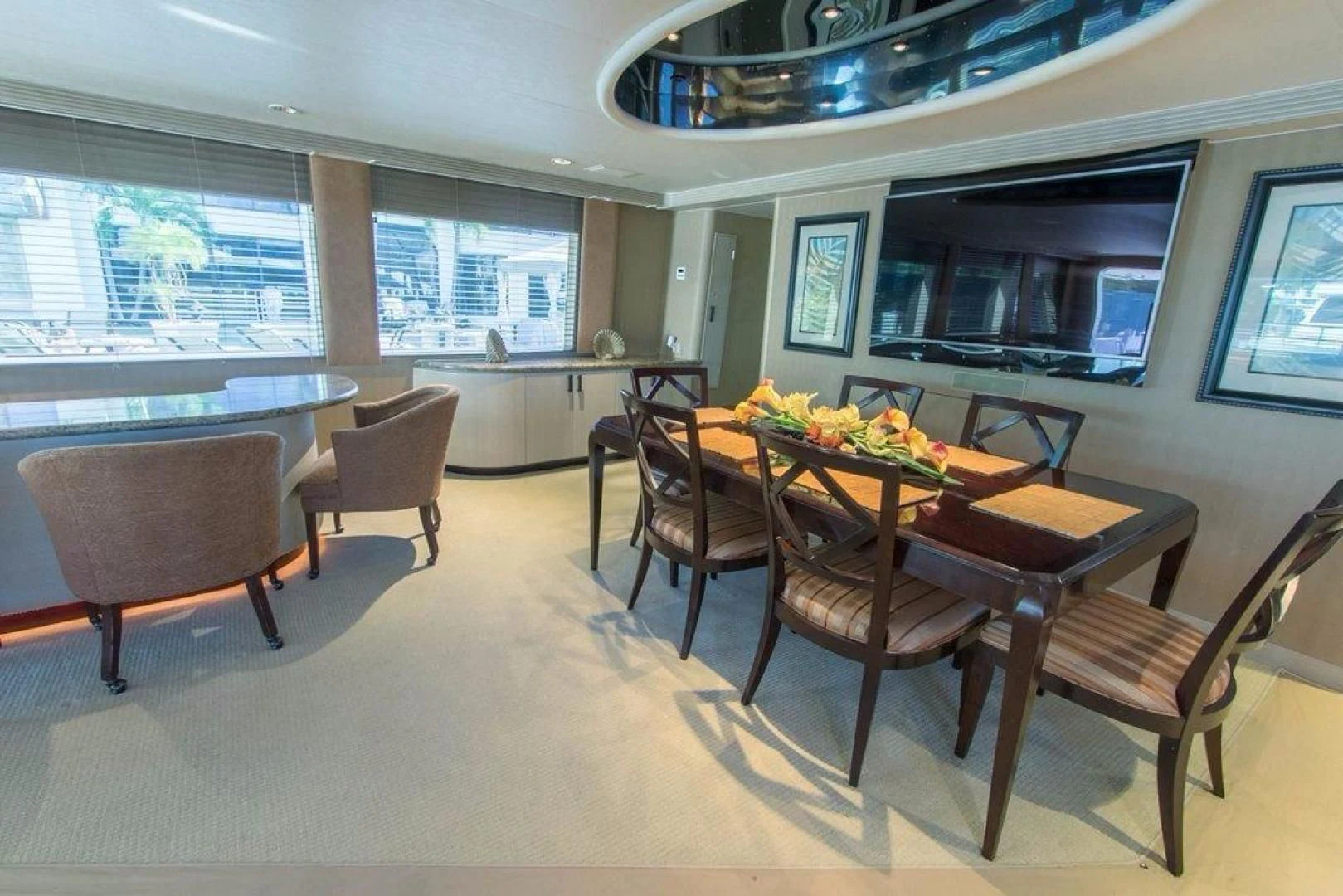 a large dining table in a room aboard MONARCH Yacht for Sale